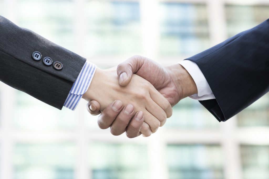Firm handshake of businessman